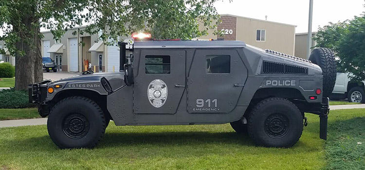 Image of dark green military vehicle